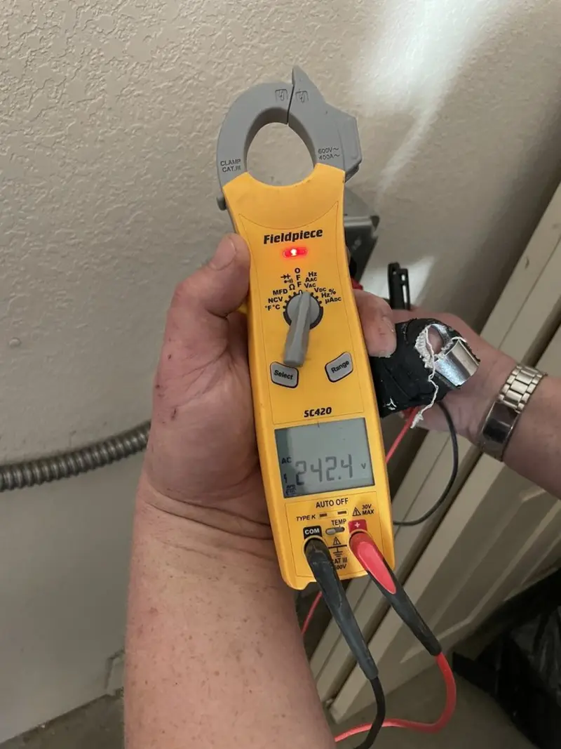Voltage testing with clamp meter during Electrical Installation Services in Campton Hills